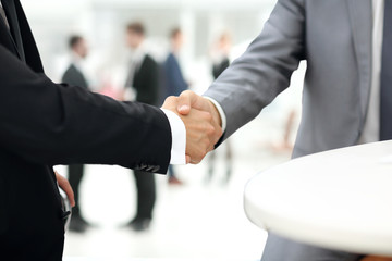 Business people shaking hands over a deal