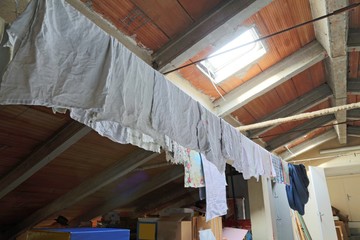 Obraz na płótnie Canvas clothes hanging in the attic of a nursery