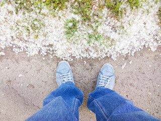 Feet on the pavement.