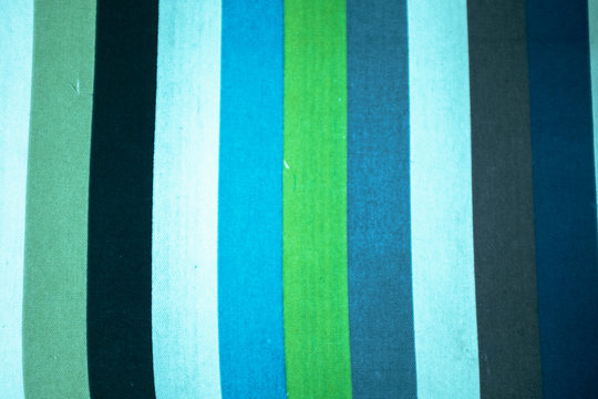 Fabric with vertical lines of different colors.