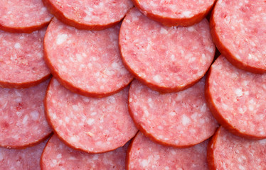 Sliced pieces of smoked salami sausage