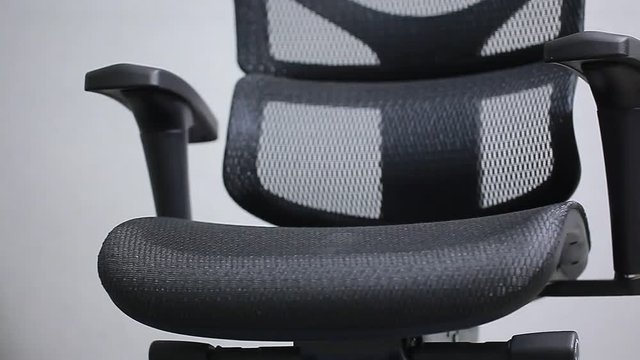 orthopedic chair ergonomic computer workstation on a gray background