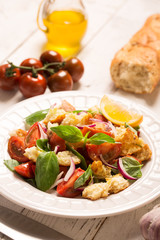 Italian Appetizer salad with tomatoes, bread and bazil