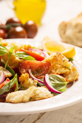 Italian Appetizer salad with tomatoes, bread and bazil