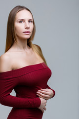 Long-haired woman in red dress