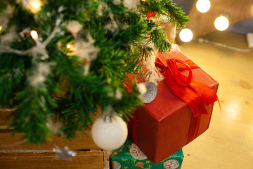Christmas balls on the festive Christmas tree raised gifts, chri