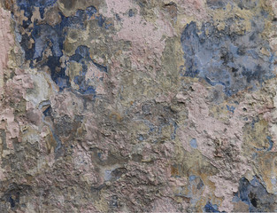Multicolored and multilayer peeling paint. Old concrete background. Broken wall. Abstract textures.