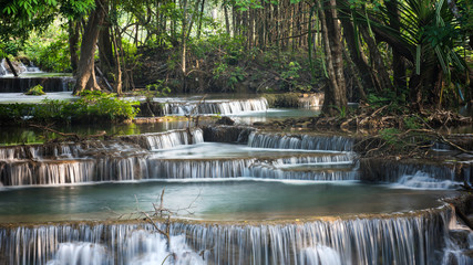 Fototapeta na wymiar Breathtaking waterfall in deep jungle, Huay Mea Kamin's Waterfall, Located Kanchanaburi Province, Thailand