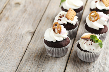 Chocolate cupcakes on a grey wooden table