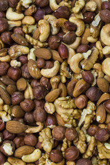 Background mix of nuts and raisins shot close-up