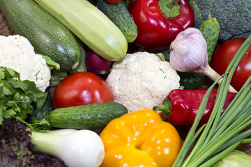 Background of fresh vegetables and greens closeup