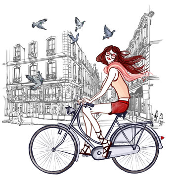 Woman Riding A Bicycle In Paris