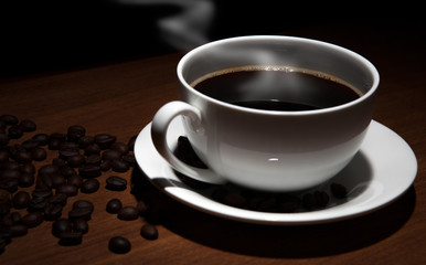 cup of coffee and beans on the table