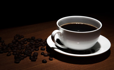 cup of coffee and beans on the table