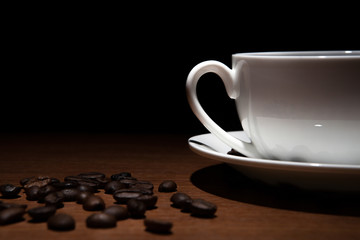cup of coffee and beans on the table