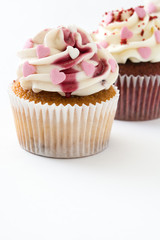 Valentine cupcakes decorated with sweet hearts isolated on white background.copyspace
