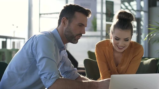 Two people talking during business meeting at cafe