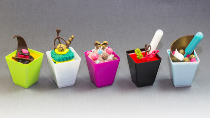 Mini desserts and meat canapes vegetable snacks in plastic cups canaps