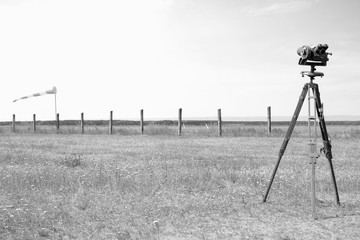  Red-white windsock and Geodetic instruments on the airfield.