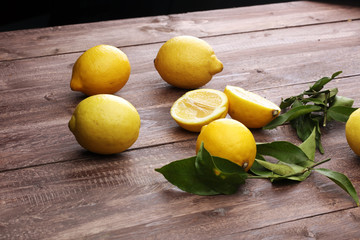 Pile of lemons on wooden table