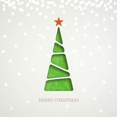 Paper green Christmas tree on light background with sparkle, shine and shadow.