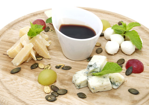 Cheese plate with several varieties of cheese in the restaurant