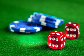 stack of chips play poker on green background close up