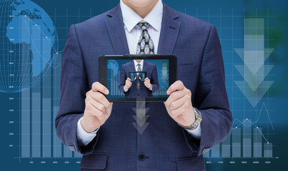 Businessman on chart background loss and shows in the mobile computer itself.