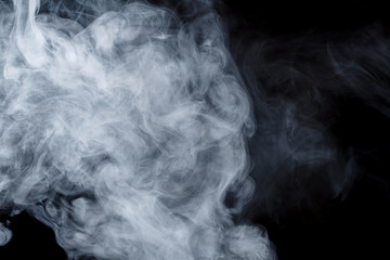 Abstract smoke Weipa. Personal vaporizers fragrant steam. The concept of alternative non-nicotine smoking. Blue smoke on a black background. E-cigarette. Evaporator. Taking Close-up. Vaping.