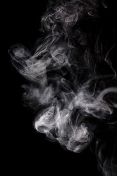 Abstract smoke Weipa. Personal vaporisers fragrant steam. The concept of alternative non-nicotine smoking. Smoke on a black background. E-cigarette. Evaporator. Taking Close-up. Veyping.