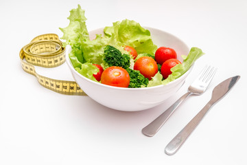 concept diet fresh vegetables on plate at white background