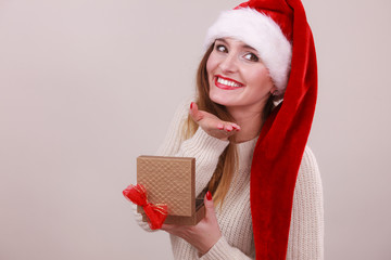 Woman opening gift box. Christmas time