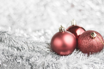 Fototapeta na wymiar Red Christmas balls on shiny background