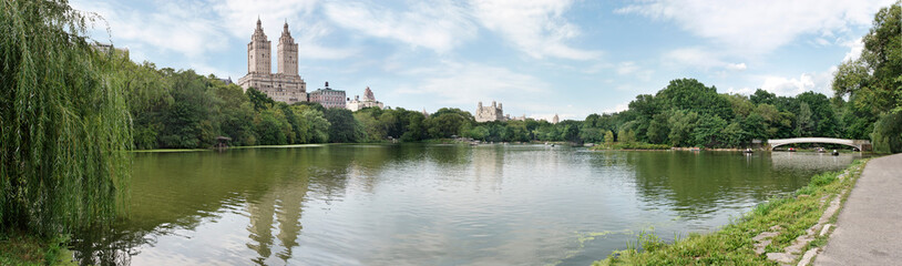 Fototapeta na wymiar Rowing on the lake in Central Park, New York, on a summer afternoon
