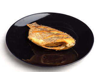 fish fry on black plate ,Tilapia Fish,planil.