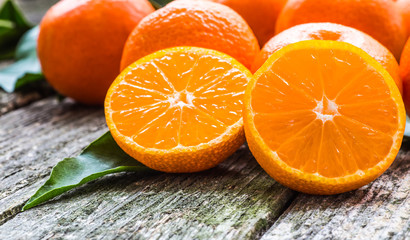 Fresh mandarin oranges fruit on wooden table