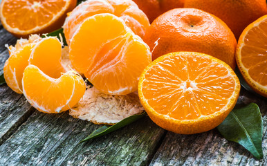 Fresh mandarin oranges fruit on wooden table