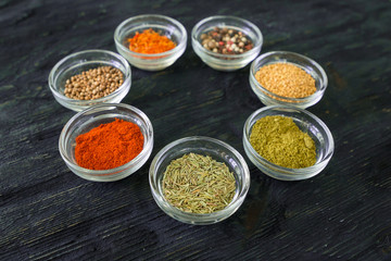 Various spices and herbs on white background.