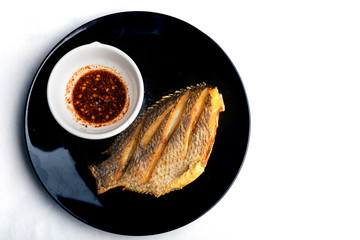 fish fry on black plate ,Tilapia Fish,planil.