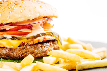 homemade hamburger with beef, onion, tomato, lettuce and cheese.