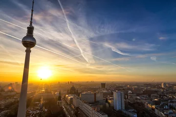 Fotobehang Berlin, Germany - December 2016: TV Tower "Alex" with beautiful sunset, panoramic view onto Alexanderplatz. It is one of Berlin's most famous landsmarks and is the tallest structure in Germany. © indigo641