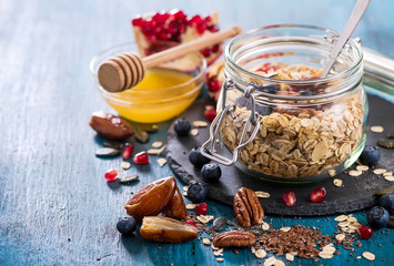 Granola with berries, nuts, cereals and seeds, healthy breakfast concept - 131135318