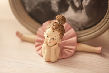 Ballerina on twine. Figurine of ballerina dancer. Ballroom dancing concept