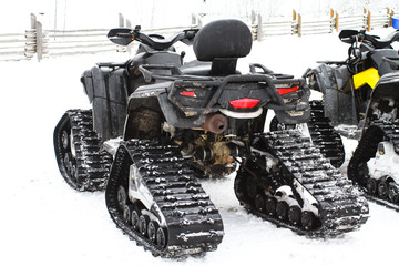 Quad bike for the winter. ATV wheels and tracks.
