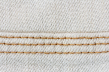 texture of white denim with a triple seam