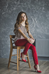 Studio portrait of woman in red jeans 6940.