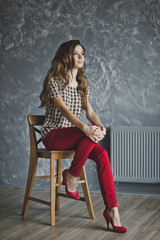 Studio portrait of woman in red jeans 6941.