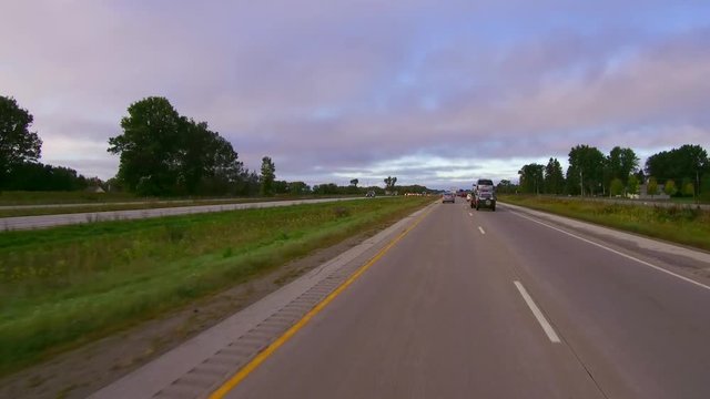 Morning rush hour highway hyperlapse, traffic moving at simulated speed of 300 miles per hour; time lapse.