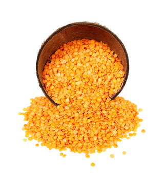 pile red lentils with coconut bowl  isolated on white