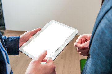 Close up of Man's hands working with digital tablet at business meeting for working concept, selective focus